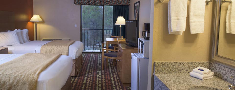 View of the Poolside Room with 2 Queen Beds and Mini-fridge with Balcony at the Best Western Ambassador Inn Wisconsin Dells