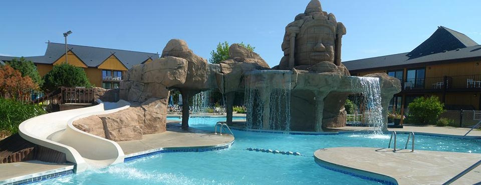 View of the Polynesian Water Park Resort Outdoor Pool with Waterfall and Water Slide 960
